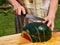 Cutting slices of fresh ripe water melon