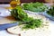 Cutting sorrel with knife on a kitchen board