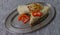 Cutting tortilla on a tin tray