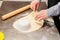 Cutting uncooked dough into circle
