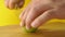 Cutting up a lime with kitchen knife