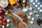 Cutting wooden board with traditional pizza preparation ingredients: mushrooms, tomatoes sauce, basil, olive oil, cheese