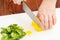 Cutting yellow and green paprika
