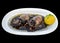 Cuttlefish grilled in ink with lemon. isolated