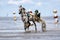 Cuxhaven, Germany - July 22, 2018: equestrian at the horse race in the mud flat at Duhner Wattrennen