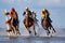 Cuxhaven, Germany - July 22, 2018: equestrian at the horse race in the mud flat at Duhner Wattrennen