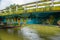 CUYABENO, ECUADOR - NOVEMBER 16, 2016: Bridge over the Cuyabeno River with a boat below it, Cuyabeno National Park in