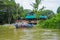 CUYABENO, ECUADOR - NOVEMBER 16, 2016: Unidentified man on a boat in the Cuyabeno river, depth of Amazon Jungle in