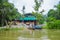 CUYABENO, ECUADOR - NOVEMBER 16, 2016: Unidentified man on a boat in the Cuyabeno river, depth of Amazon Jungle in