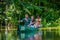 CUYABENO, ECUADOR - NOVEMBER 16, 2016: Unidentified people travelling by boat into the depth of Amazon Jungle in