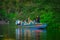 CUYABENO, ECUADOR - NOVEMBER 16, 2016: Unidentified people travelling by boat into the depth of Amazon Jungle in