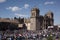 cuzco in festival of the sun inti raymi with people dancing in the square with the cathedral,