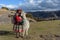 Cuzco, Peru - July 14, 2018. Peruvian woman dressed in traditional colourful clothes with alpaca / llama at Sacsayhuaman, Cusco, P