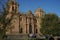 Cuzco, Peru - View of the Plaza de Armas of Cuzco, people and some traffic, and the church of the Company of Jesus