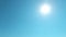 Cyan blue sky background with sun light ray flare TimeLapse