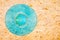 Cyan color vinyl record on plywood background