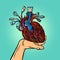 Cyber heart in human hand