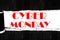 Cyber monday on open ripped paper,black wooden plank background.