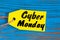 Cyber Monday sales tag. Yellow color tags on blue wooden background