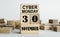 CYBER MONDAY is written on wooden cubes stacked in the form of a mobile calendar