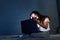 Cyberbullying concept. Teen tired girl sitting on the bed with notebook.