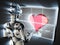 Cyborg woman and heart on hologram display