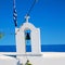 in cyclades europe greece a cross the cloudy sky and bell