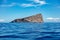 Cyclades Greece. Piperi rock, blue sky, rippled Aegean Sea between Kythnos and Serifos island