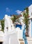 Cyclades island stone stair drives to rooftop and to Greek heaven, pot with bougainvillea. Vertical