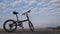 Cycle in the beach with blue sky background