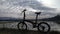 Cycle in the beach with blue sky background