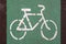 Cycle lane sign drawn in white on green