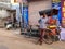 Cycle rickshaw standing by his pedicab in Taj Ganj neighborhood