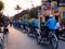 Cycle rickshaws taking a group of tourists through Hoi An old town in the evening