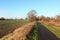 Cycle track through the arable fields of a scenic farming landscape on a sunny winter day
