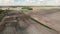 Cycling on countryside road. Cyclists riding on gravel bicycles offroad. People cycling on rural gravel road in fields. Gravel adv