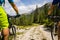 Cycling couple with bikes on track, Cortina d`Ampezzo, Dolomites