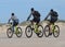 Cycling in Dunes National Park beach in Corralejo with Lobos`s Island background, in Fuerteventura ,