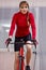 Cycling Ideas. Concentrated Caucasian Female Cyclist While at Regular Excercise on Stationary Bike Trainer Indoors During Her