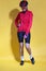 Cycling Ideas. Full Length Portrait of Confident Positive Female Road Cyclist in Professional Outfit Standing Against Yellow