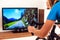 Cycling Indoor with exercise bike trainer motivating himself with the gamification of sport