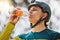 Cycling, man and drinking water for exercise, bike training or workout recovery after mountain biking marathon in forest