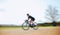 Cycling, motion blur and fitness with woman in nature and mockup for speed, workout and challenge. Exercise, fast and