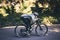 Cycling, nature and fitness with man in road for training, workout or cardio exercise. Adventure, extreme sports and