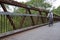 Cycling over a bridge in Crothers Woods - an urban public park with offering hiking & mountain-biking trails