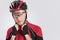 Cycling Safety Concept and Ideas. Portrait of Male Caucasian Cyclist Putting On Helmet.