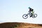 Cycling, sports and man jump with bicycle for adrenaline on adventure, freedom and in air for speed. Mountain bike