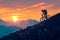 Cycling into the sunset mountain bikers silhouette against dusk sky