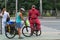 Cycling travel. People ride bicycles with luggage.