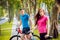 Cycling young couple. In the park. Beautiful bicycle lane.